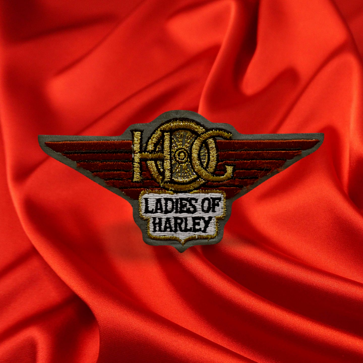 #020 A traditional sew‑on Ladies of Harley H.O.G. patch featuring elegant stitching and iconic LoH styling. Perfect for jackets, cuts, and riding gear, it adds authentic identity and a touch of feminine strength. Durable, timeless, and proudly representative of every Ladies of Harley rider.